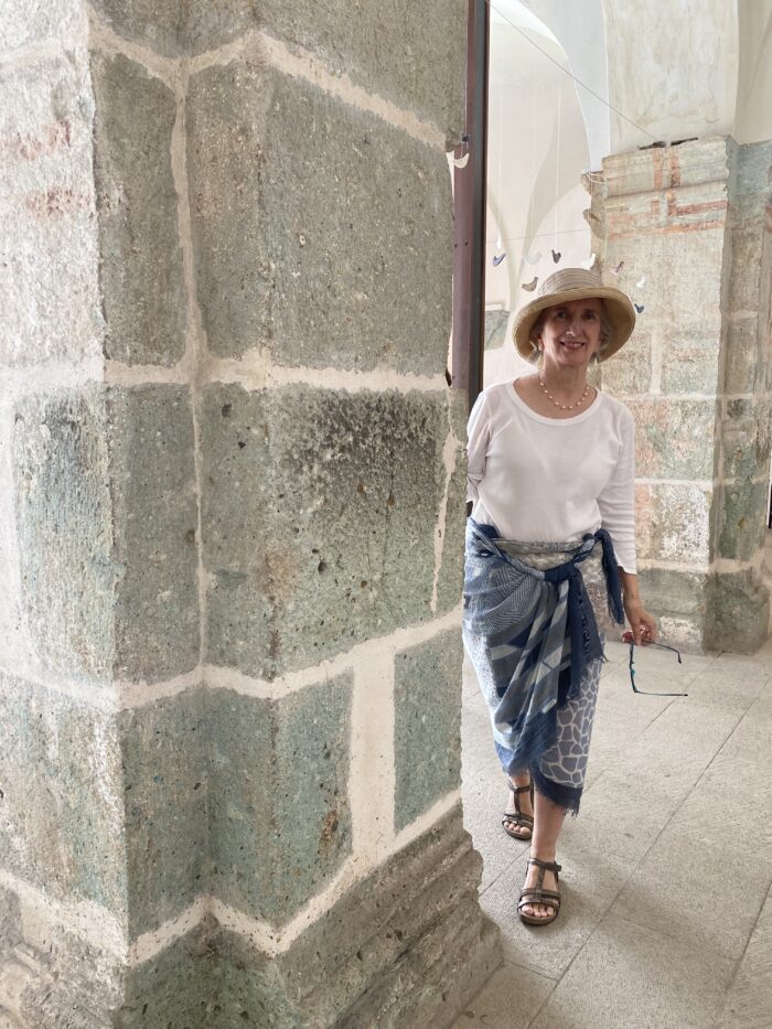 Teresa standing by stone archway at the Oaxaca Cultural Centre.